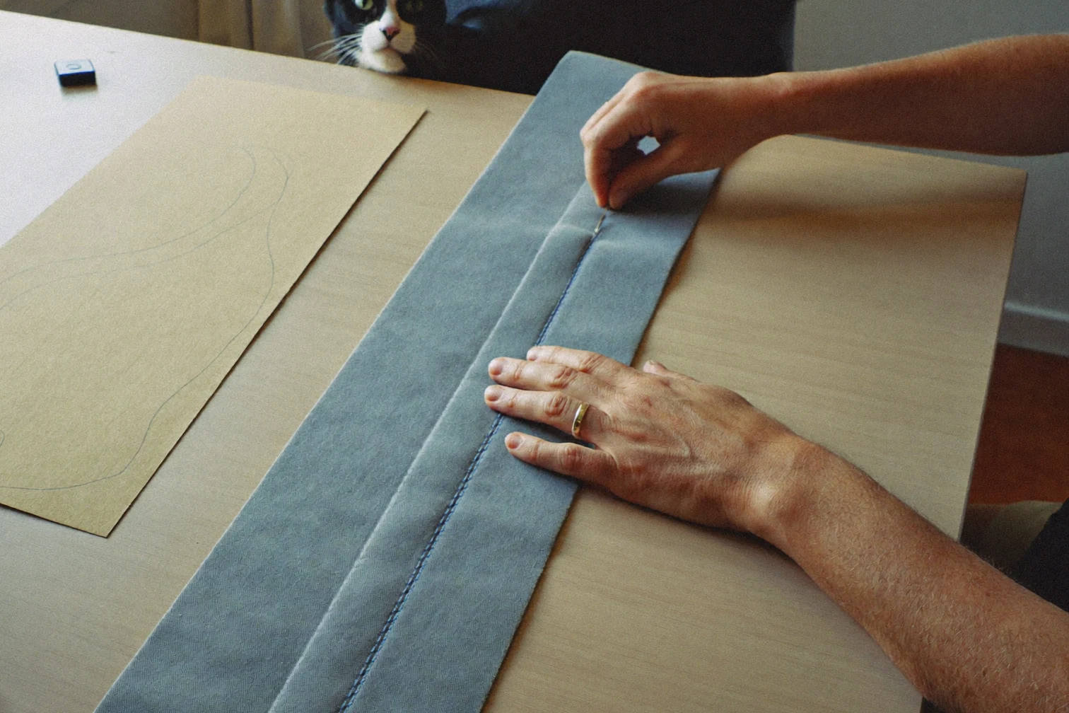 Sewing a sturdy cat kicker toy at a bright maker workbench